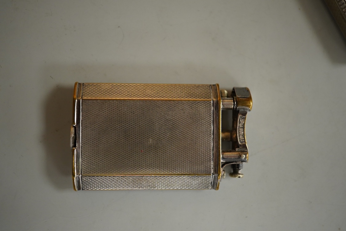 Two vintage lighters comprising an Everest 925 silver lighter, 49mm and a Dunhill plated lighter